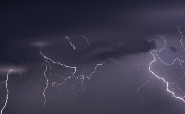 Large lightning strike at dusk on Tornado Alley